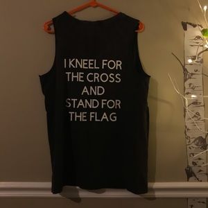 I kneel for the cross and stand for the flag